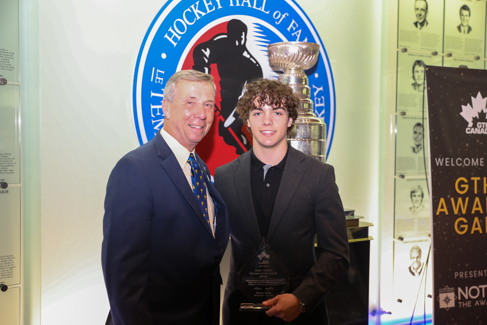 Jim Nother Presenting an award to a young hockey player